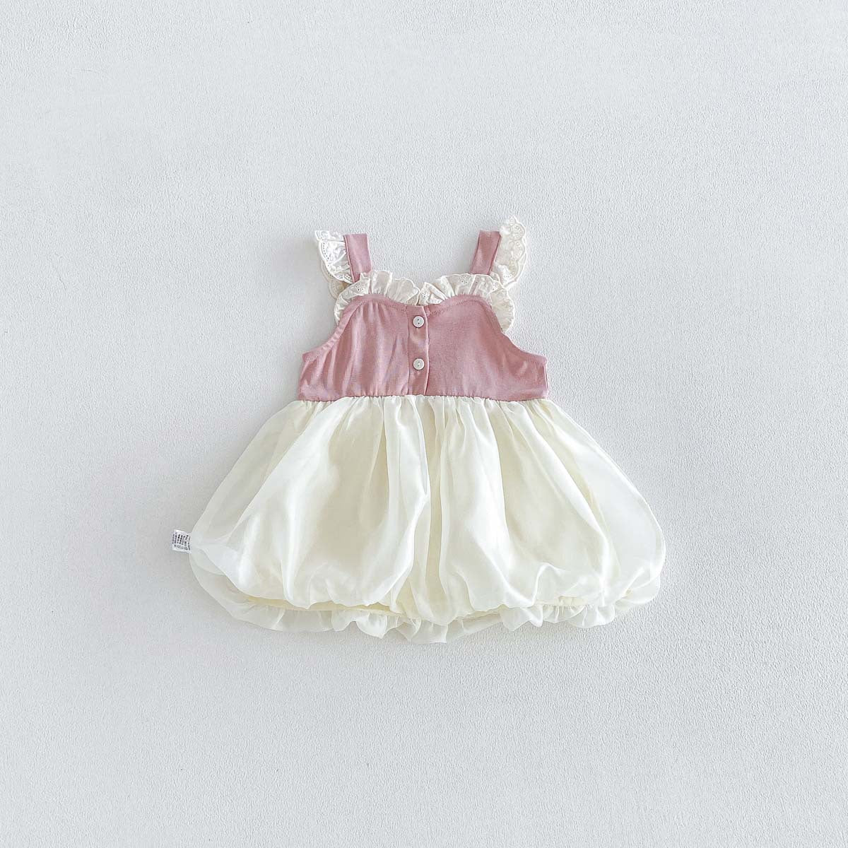Barboteuse-robe bouffante rose et crème en dentelle – nœud en satin, jupe en tulle et body (3 mois–3 ans)