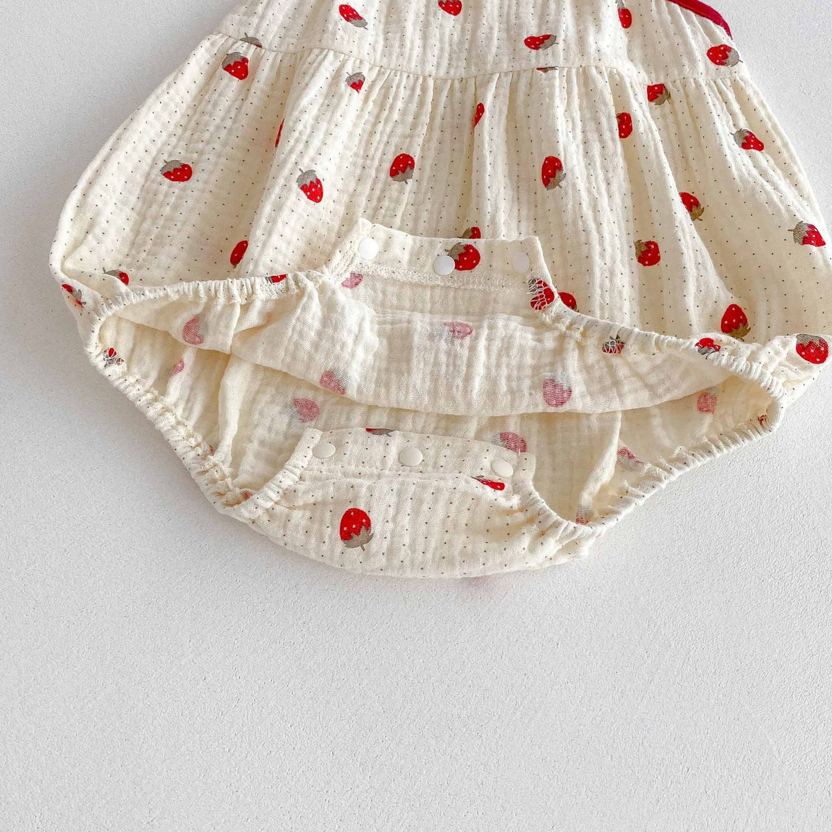 Strawberry Fields Muslin Romper – 3D Strawberry Detail Tie-Strap Bubble Bodysuit (0–18M)    Mimou Babywear