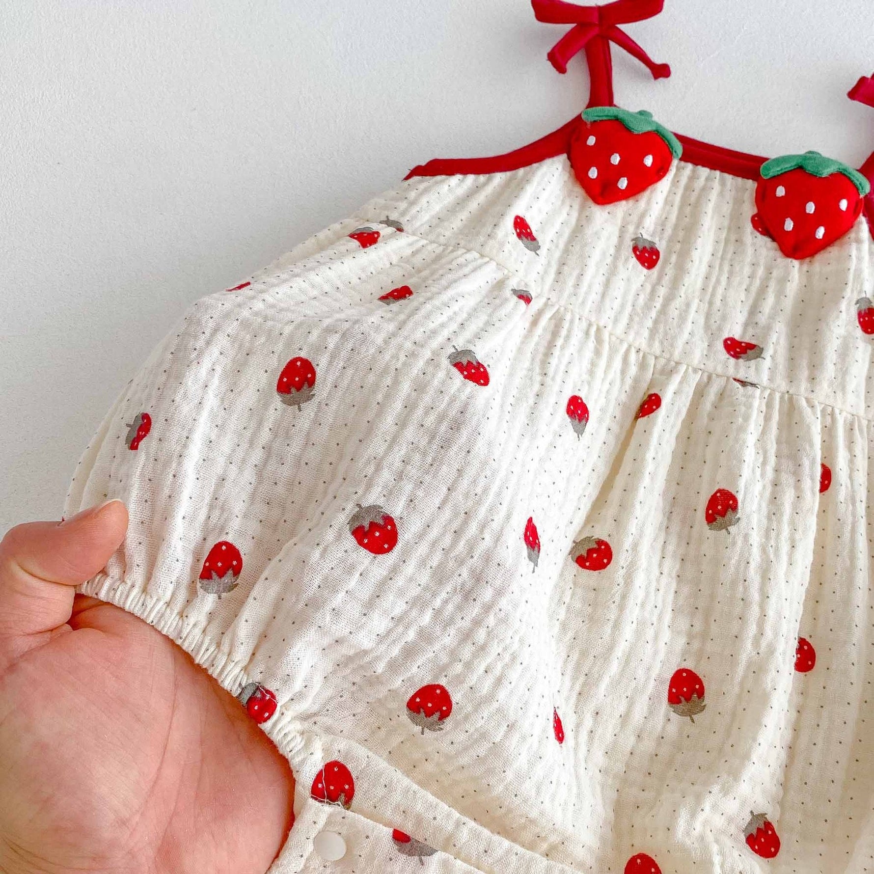 Strawberry Fields Muslin Romper – 3D Strawberry Detail Tie-Strap Bubble Bodysuit (0–18M)    Mimou Babywear