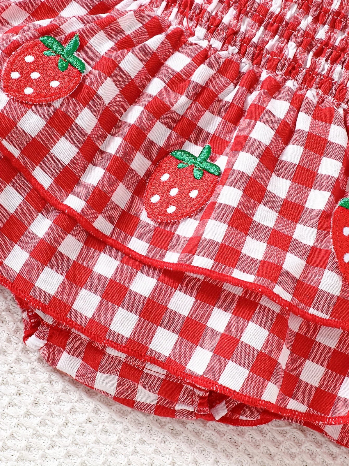 Strawberry Gingham Smocked Romper – Tie-Strap Dress with Ruffle Skirt (0–18M)    Mimou Babywear