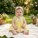 Yellow Gingham Duck Romper Dress lifestyle photo outdoor garden
