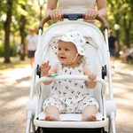 Black Cherry Print Bubble Romper & Bucket Hat baby in stroller summer lifestyle photo